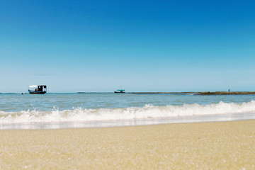 Fototapeta na wymiar Beautiful tropical beach sea and sand on blue sky and white cloud for travel and vacation Porto Seguro - Brasil - Image