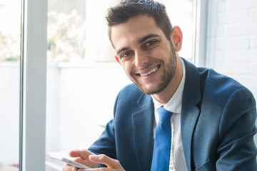 attractive business man with mobile phone