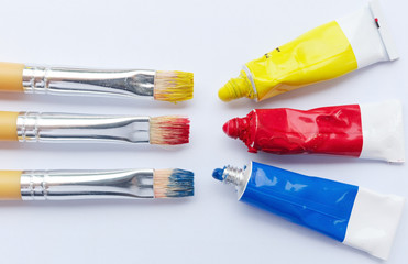 Three primary colors on white background.Red, blue and yellow color tube