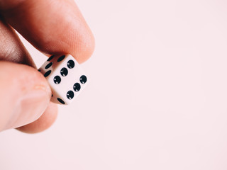 Classic play board game dices in hand. Toning