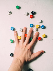Color dices in hand. Board game casino risk luck