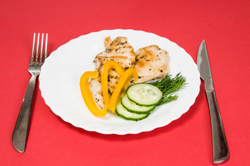 grilled chicken fillet on white plate