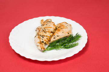 grilled chicken fillet on white plate