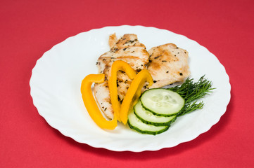grilled chicken fillet on white plate