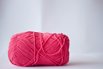 Ball of yarn in a white background