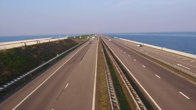 32 kilometer long dike Afsluitdijk along traffic in the Netherlands.a dike separating it of the sea and ijsselmeer