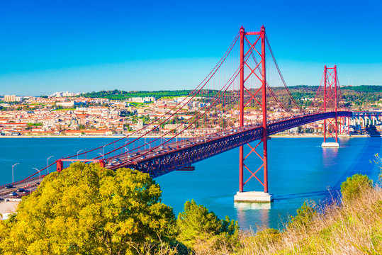The 25th April Bridge (Ponte 25 de Abril) in Lisbon, Portugal. View from Almada