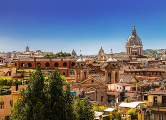 Fototapeta premium The domes and rooftops of the eternal city, the view from the Spanish steps. Rome, Italy