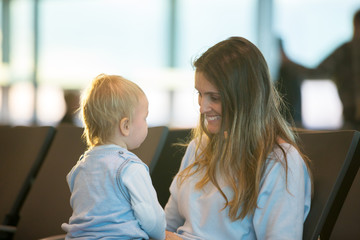 Children, traveling together, waiting at the airport to board the aircraft