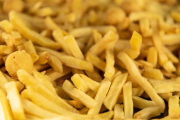 Raw pile of french fries with shallow depth of field