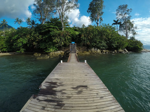Wooden pier and green island