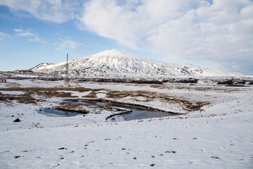 Fototapeta na wymiar Winter landscape from The Malarrif Lighthouse at Sanaefells peninsule West of Iceland