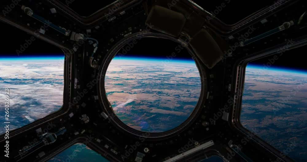 Wall mural the surface of the earth from the window of a spaceship. elements of this video furnished by nasa
