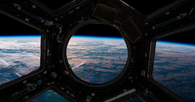 The surface of the Earth from the window of a spaceship. Elements of this video furnished by NASA