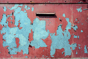 Texture of galvanized iron, painted red. Horizontal texture of red peeling paint with cracks