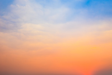 Beautiful natural background of twilight blue and orange sky with cloud in morning and evening time before sunrise or after sunset.