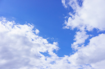 Naklejka na ściany i meble Beautiful white fluffy clouds in the blue sky day, cloud day. It best for background, abstract or blur.