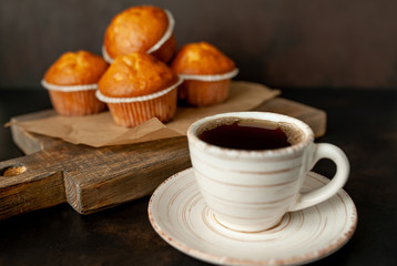 cupcakes and coffee on a background of concrete