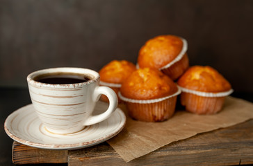 cupcakes and coffee on a background of concrete