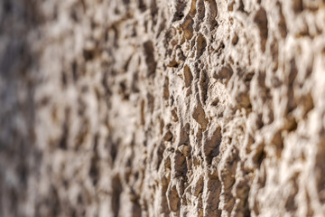 Obraz premium Decorative exterior wall plaster with embossed surface. Selective focus image