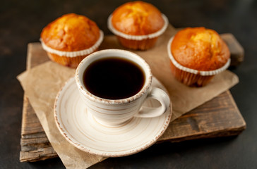 cupcakes and coffee on a background of concrete