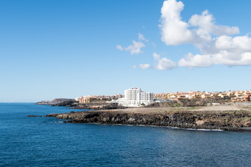 Fototapeta na wymiar Beautiful seascape landscape and holiday apartments along the coast of El Medano, Costa del Silencio, Tenerife, Spain.