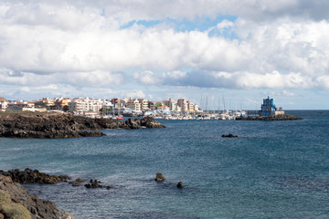 Blue harbormaster house restaurant and view over the beautiful sunny harbour of Marina del Sur in...
