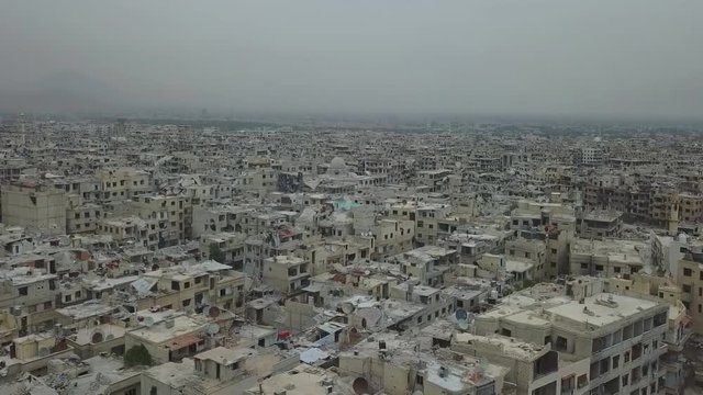 city of Aleppo, Syria, drone flight among the destroyed houses