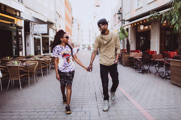 The love story of a guy and a girl on the city streets. Young people travel. Spring walk around the city.