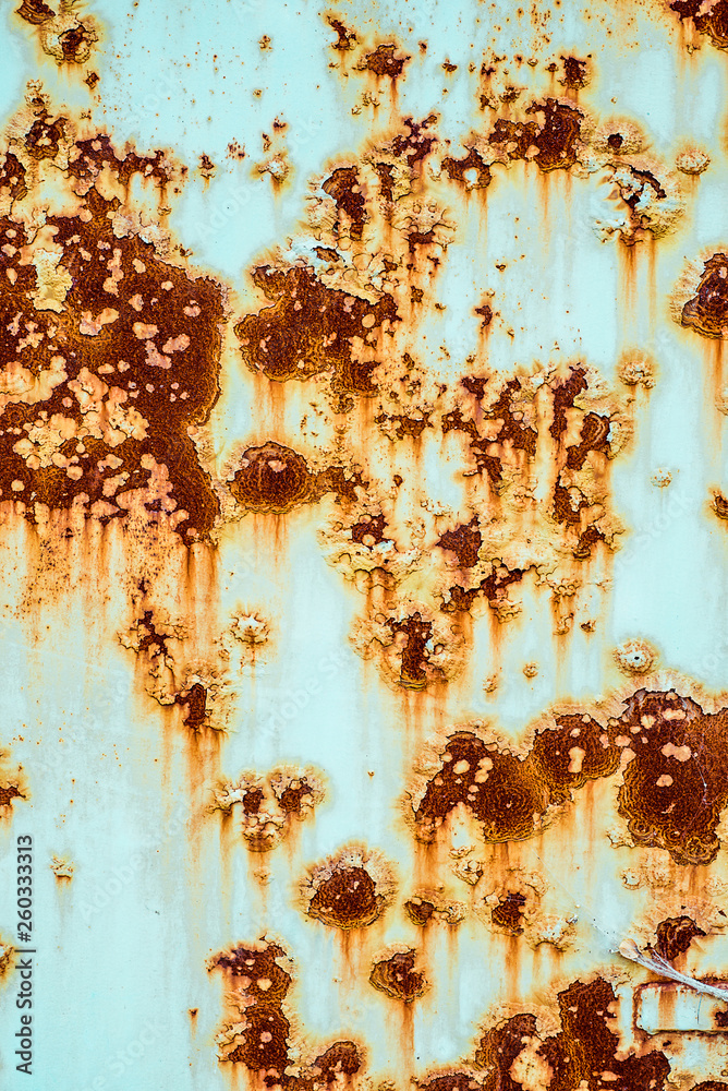 Wall mural Texture of rusty metal, painted white which became orange spots from rust. Vertical texture of paint on rustic steel