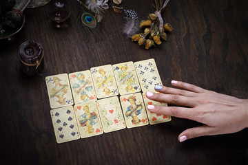 Divination cards. The fairy spreads the cards. The clairvoy arranges solitaire.