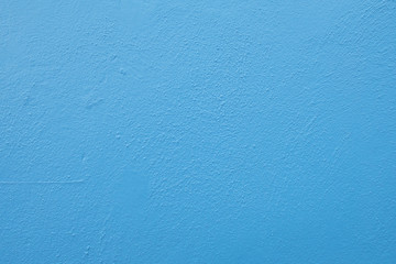 Baby blue plastered wall bakcground texture.