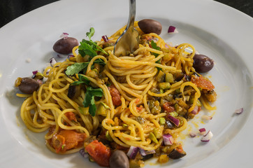 Pasta with vegetables and olives