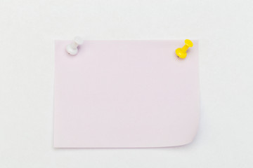 Note with a paper clip. Isolated on a white background