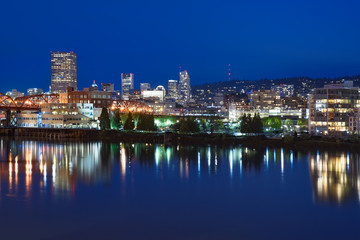 Fototapeta na wymiar Night panorama of Portland, Oregon. Reflections of city lights in Willamette river