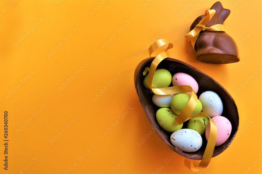 Wall mural  Colored chocolate Easter eggs and chocolate bunny