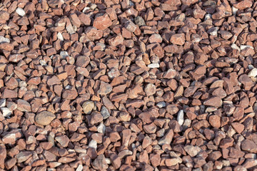 Red Brown Gravel or Soil Texture Background for Design. Real gravel texture background and small stone on ground