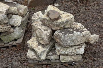 Large gray stones for landscape design on a wooden pallet