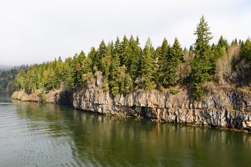 Fototapeta na wymiar Rocks and forest at high Columbia river bank, Oregon