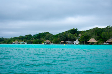Fototapeta na wymiar Bacalar Lake Lagoon in Mexico. Crystal Clear Blue and Green Water. 