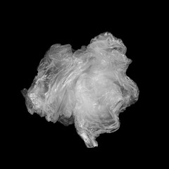 White crumpled plastic bag with a black background.