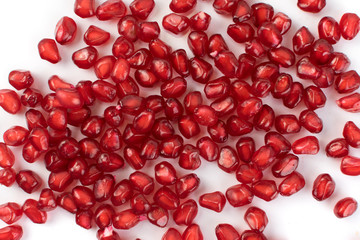 Scattered Pomegranate Seeds Isolated on White Background