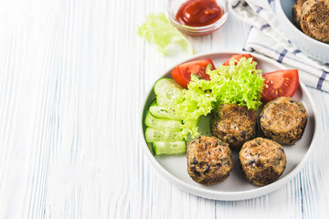 Spicy vegetarian black bean meatballs. Selective focus, space for text.