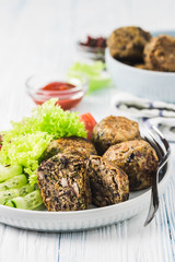 Vegan black bean mushroom meatballs. Selective focus, space for text.