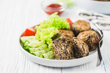 Vegan black bean mushroom meatballs. Selective focus, space for text.