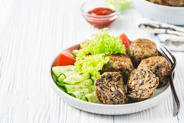 Vegan black bean mushroom meatballs. Selective focus, space for text.