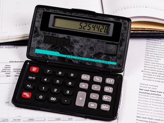 Calculator and financial documents on the table