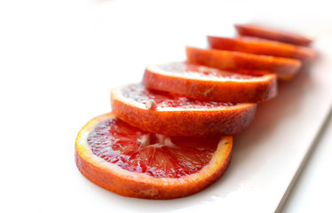 Orange red sweet ripe juicy sliced on a white background. Tropical fruit. Сopy space.Flat lay, top view.