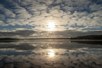 Obraz premium Reflection of cloudy sky in a lake