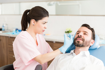 Fototapeta premium Man Taking Pain To Improve Appearance